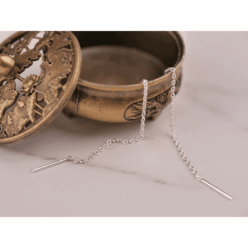 Plain threader earrings in 925 Sterling silver, shown coming out of a small decorative brass coloured pot