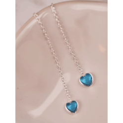Light blue threader earrings in 925 Sterling silver, shown from above on a small ceramic tray