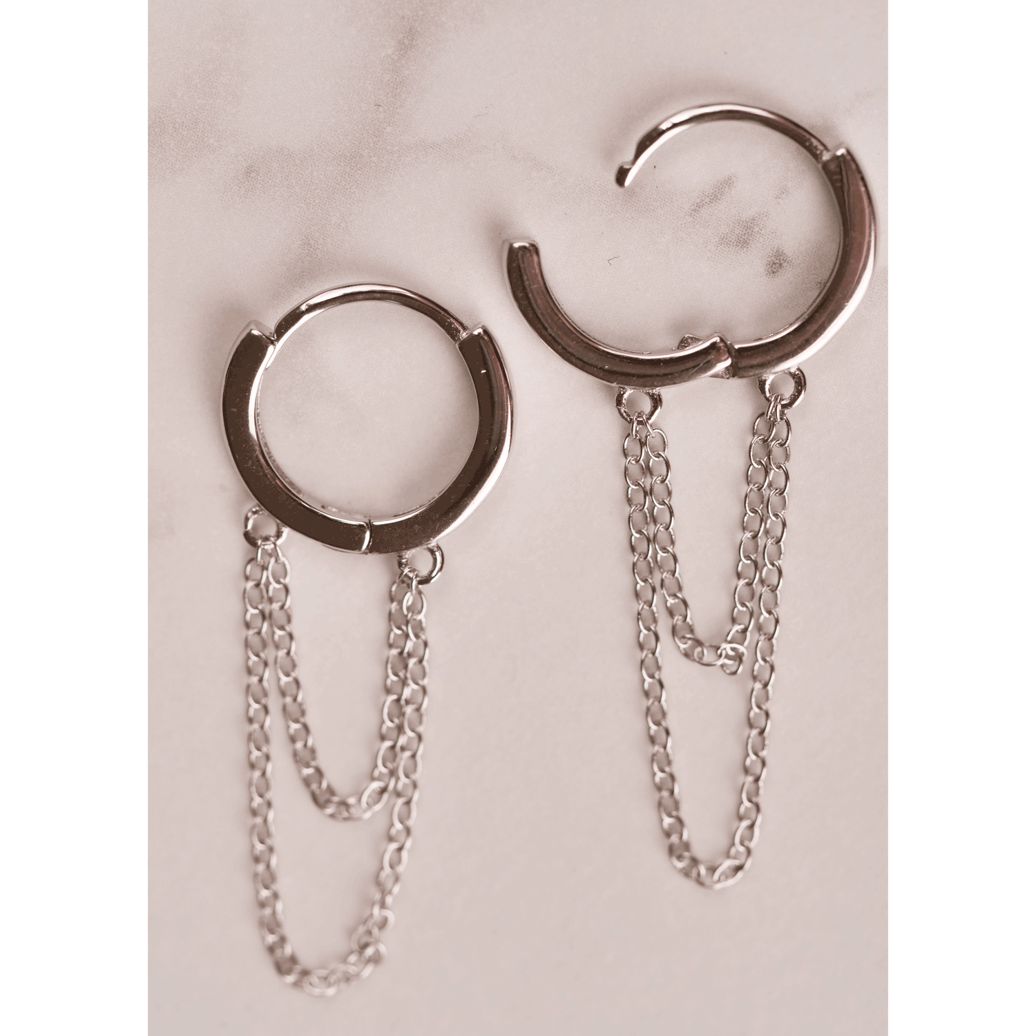 Silver chain hoops showing clasps