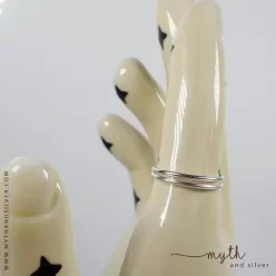 Silver adjustable double band ring on ceramic hand