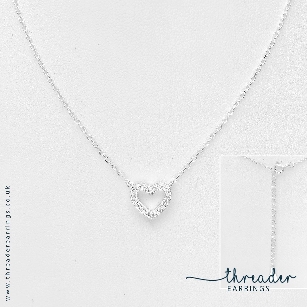 Silver cz heart necklace - view on stand