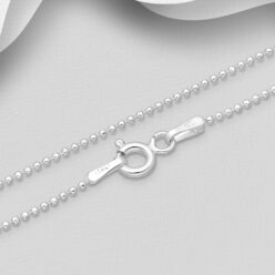 Close-up of a fine sterling silver ball chain showing the spring-ring clasp