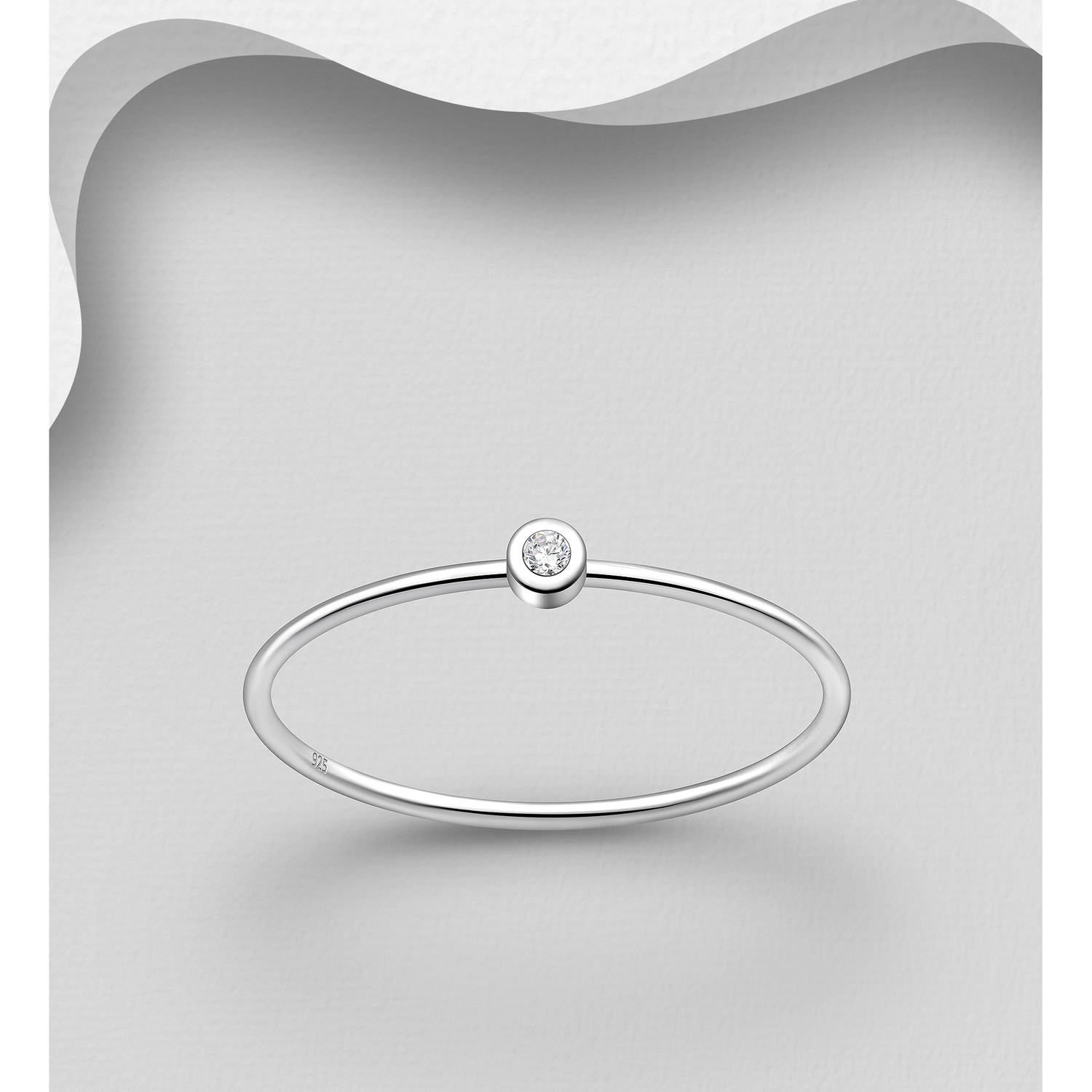 Cubic zirconia sterling silver stacking ring, shown against a grey background