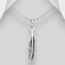 Small sterling silver oxidised feather pendant shown on a chain against a grey background