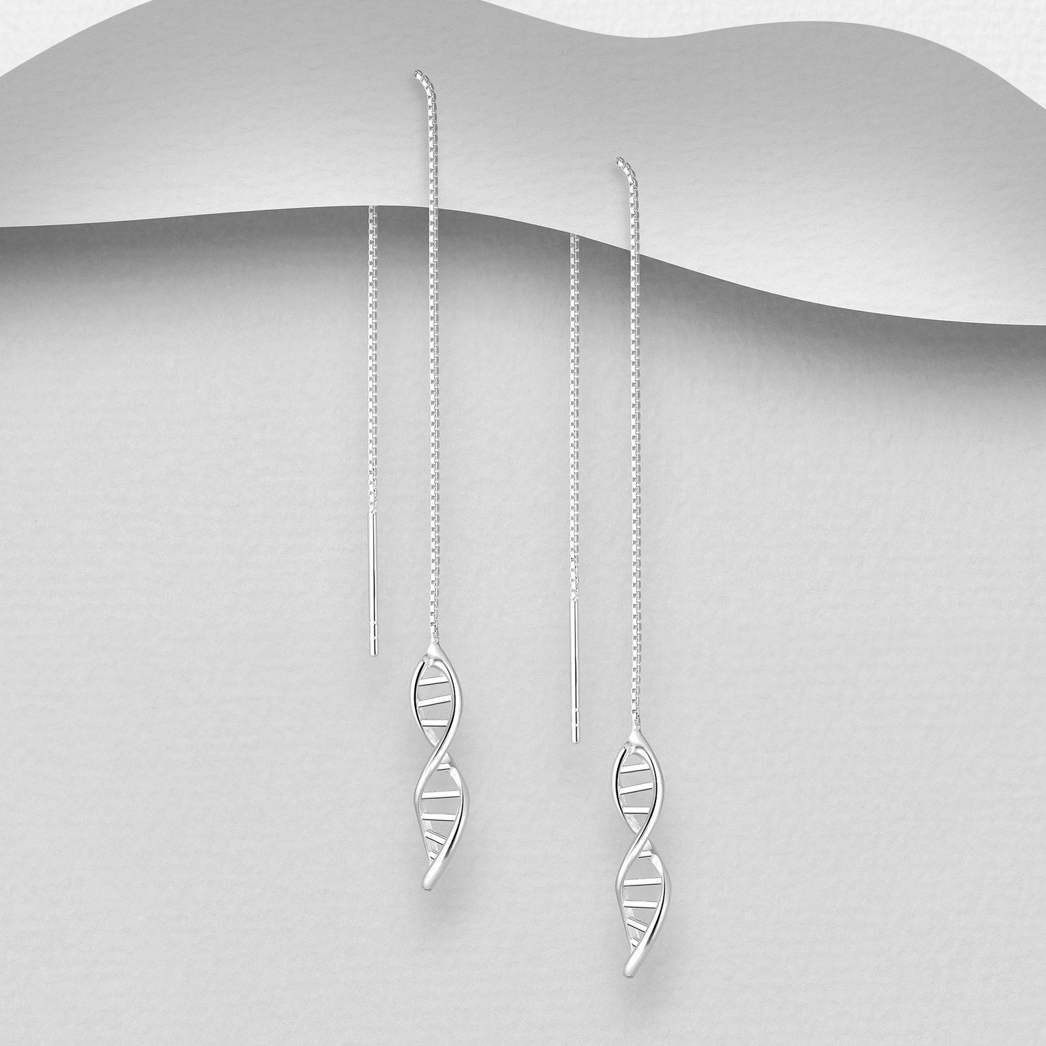 Sterling silver DNA Threader Earrings, on a grey display card