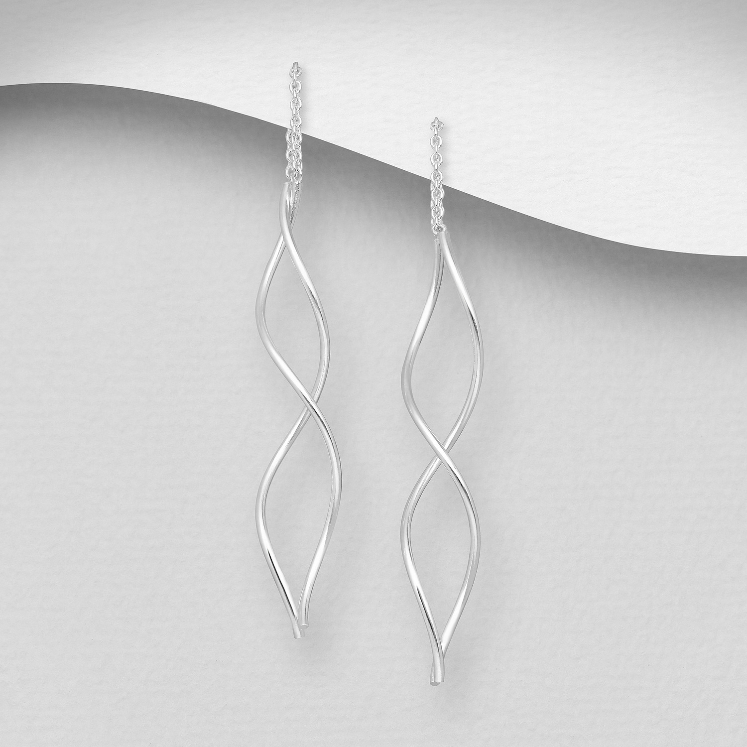 Sterling silver dual twist threader earrings, on a grey display card