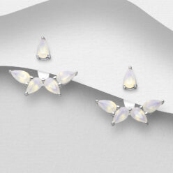 Sterling silver jacket earrings with opal-like cubic zirconia, on a grey display card