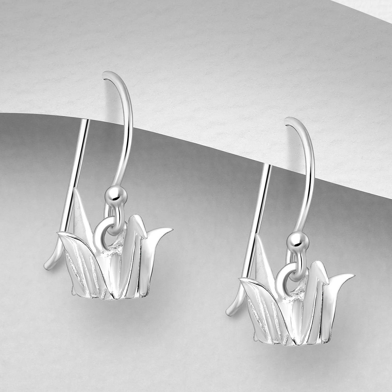 Sterling silver origami bird earrings, on a grey display card