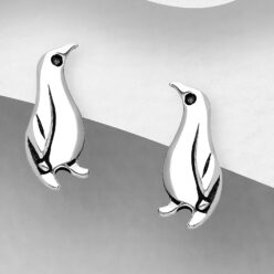 Sterling silver penguin stud earrings, on a grey display card