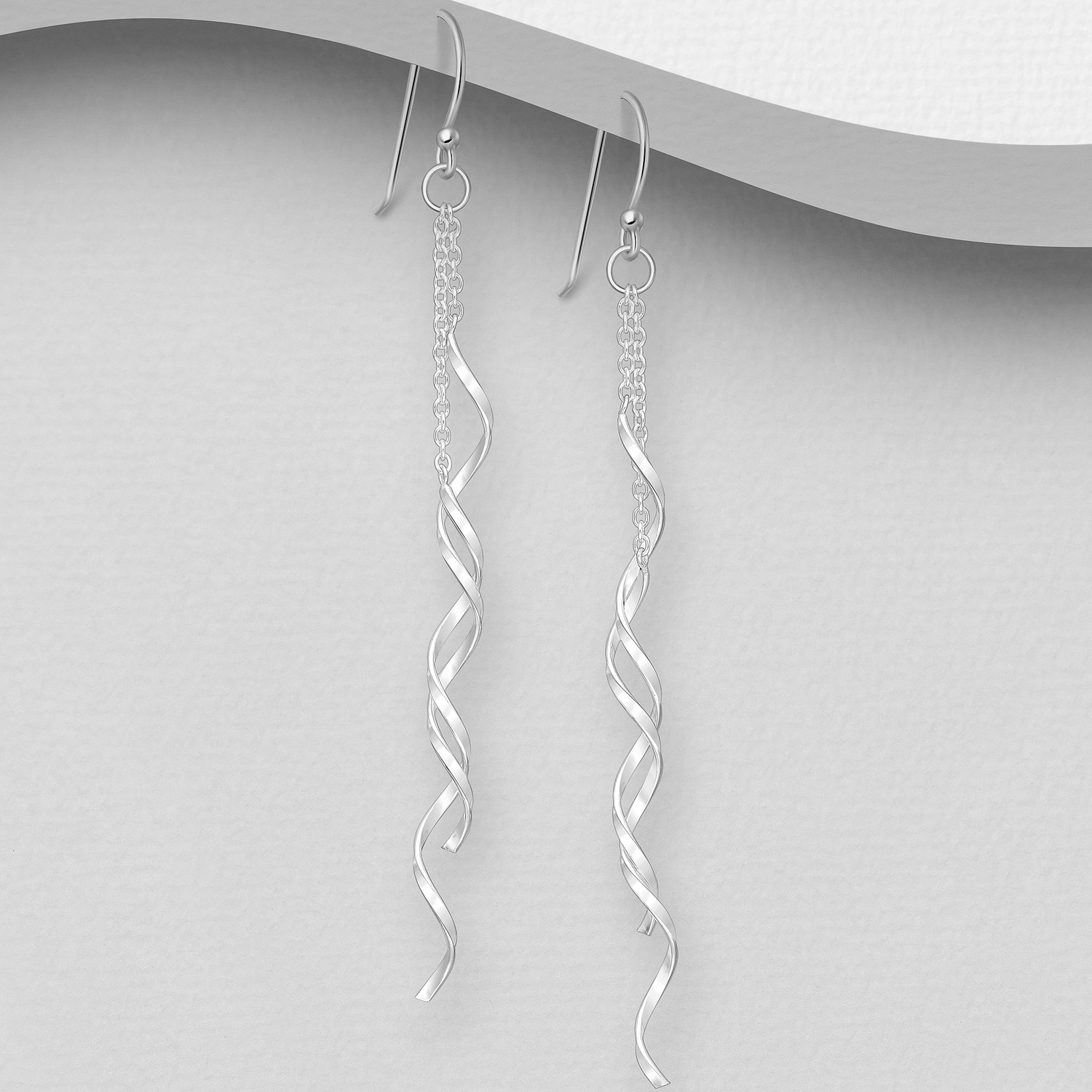 Sterling silver spiral and chain earrings, on a grey display card