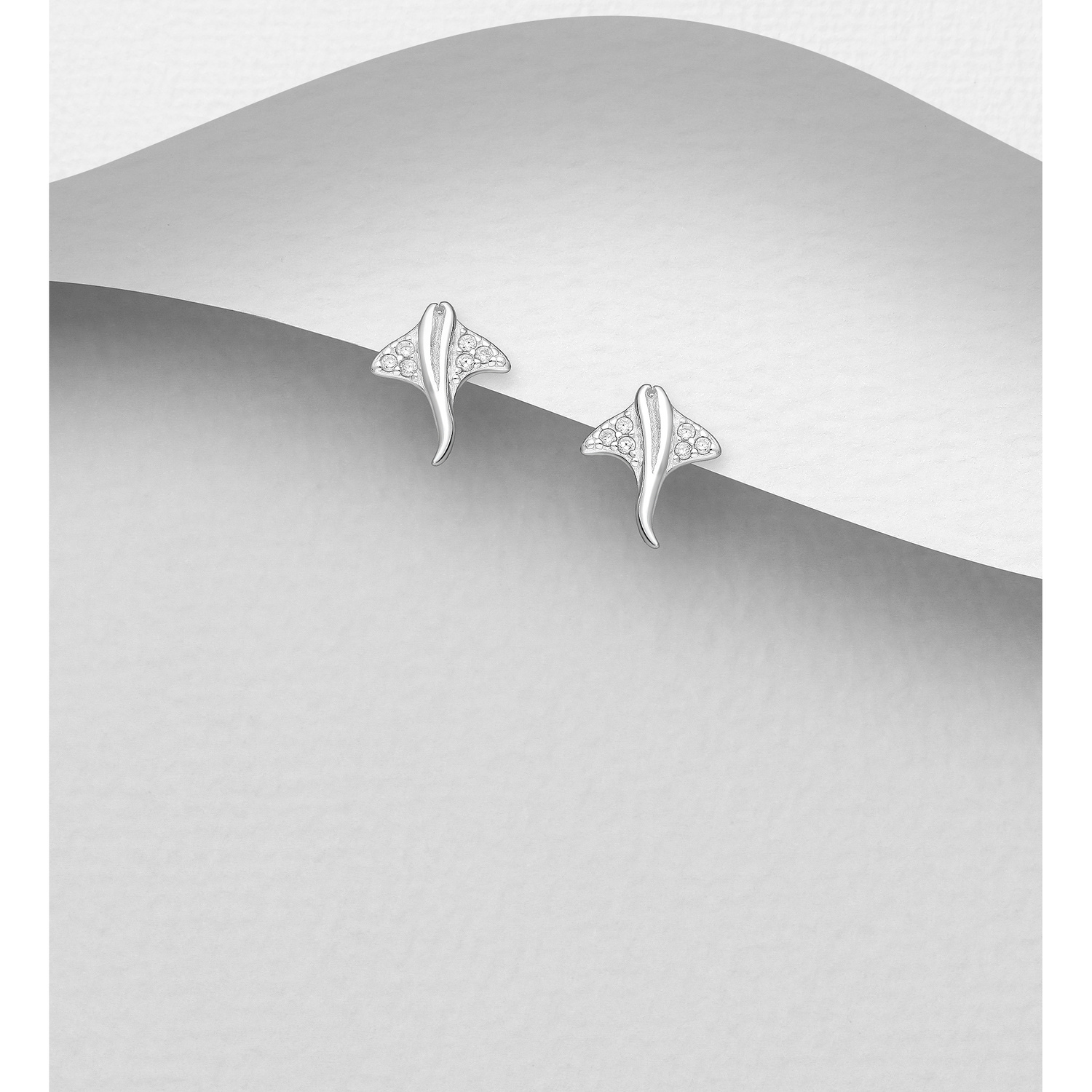 Sterling silver stingray stud earrings, on a grey display card