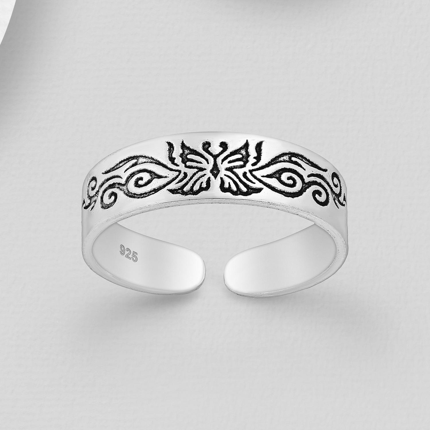 Sterling silver toe ring with oxidised butterfly design, shown against a grey background