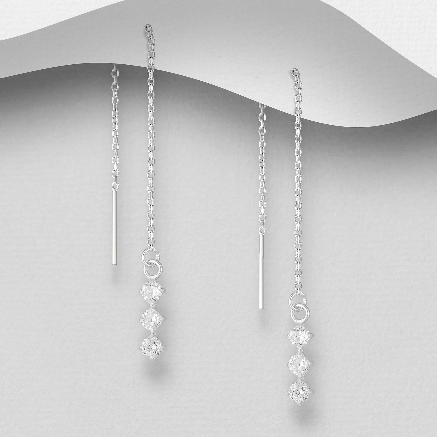 Sterling silver triple crystal threader earrings, on a grey display card