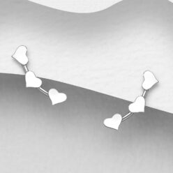 Sterling silver triple heart stud earrings, on a grey display card