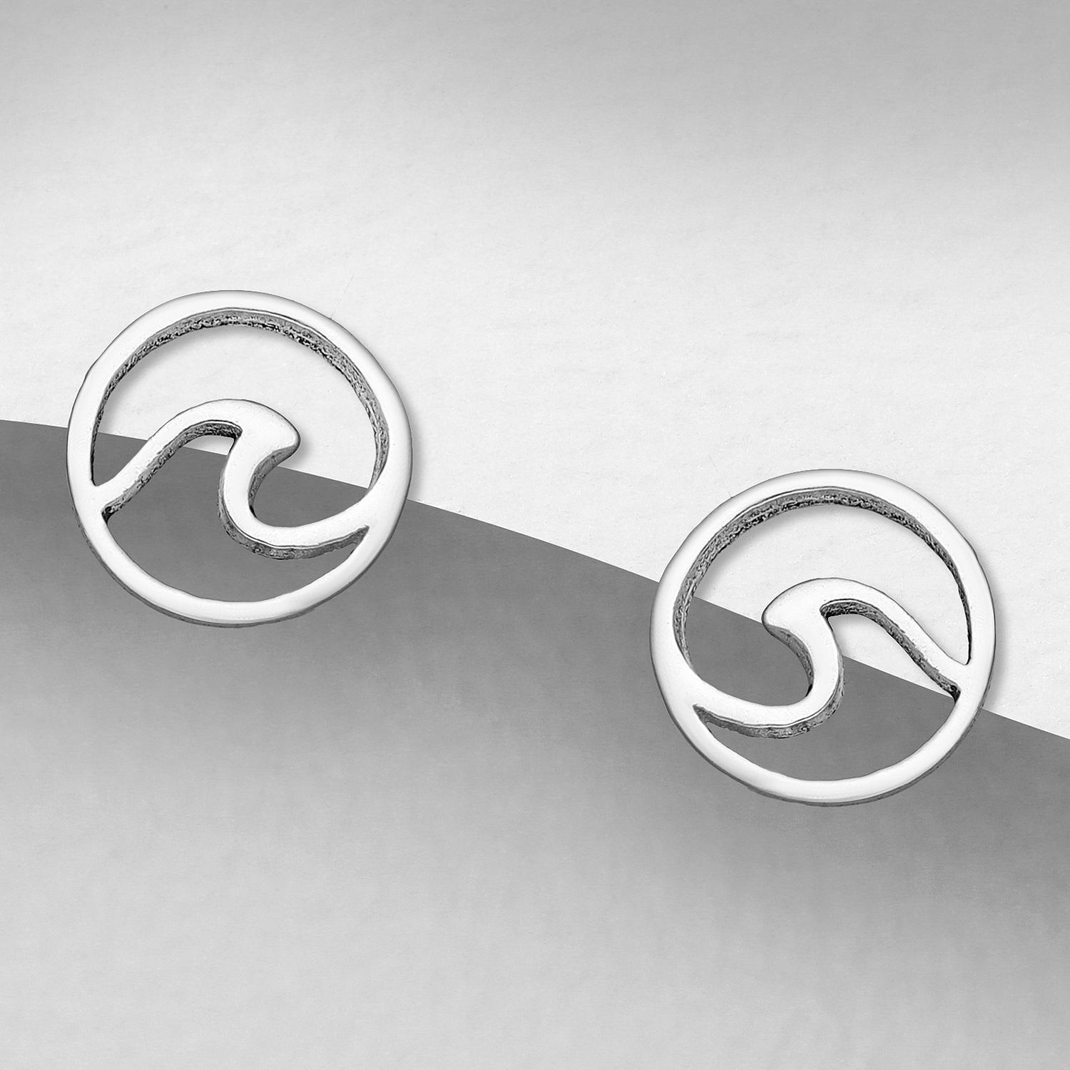 Sterling silver wave stud earrings, on a grey display card